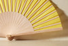 Handfächer Carla in der Farbe Gelb im Angebot bei Hitzewelle dem Online Fächerstore